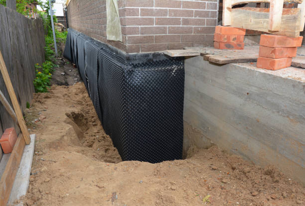 Happy homeowners after waterproofing job in Wheatfield